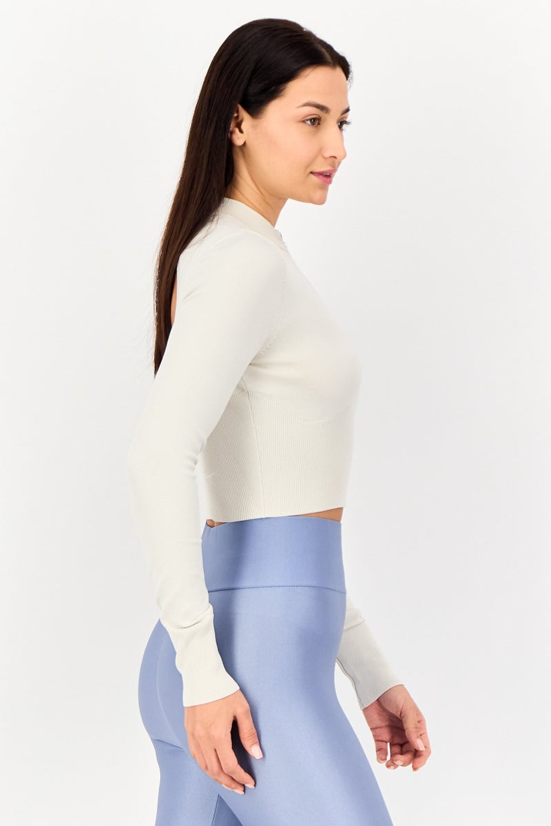 Nike بلوزة نسائية ضيقة بأكمام طويلة خارجية، كريمي - Image 2